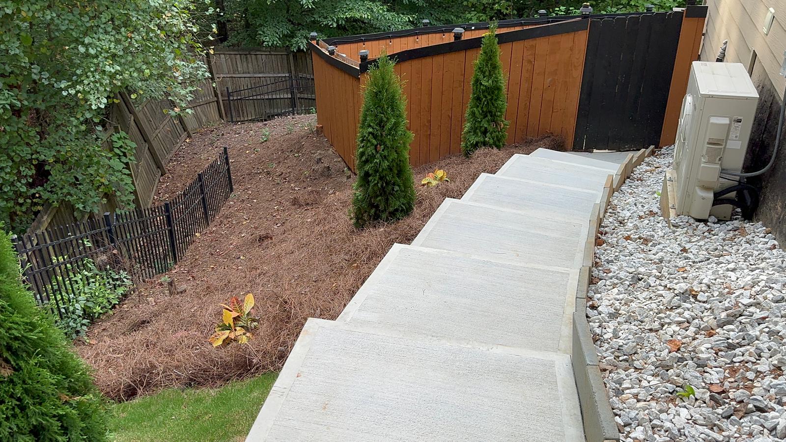 Linear Concrete Walkway with Planting Beds